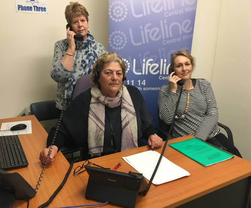 HERE TO LISTEN: Lifeline Central West crisis supporters Astrid Taylor, Stephanie Robinson and (back) Vicki Byrnes are part of a marathon effort to answer as many calls for help as possible. Photo: NADINE MORTON 090916nmlifeline3