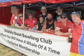 PRIME POSITION: Robbie Christian (front right) with his friends from the Wobbly Boot Bowling Club group at their campsite. Photo: CHRIS SEABROOK 100317camprs1a
