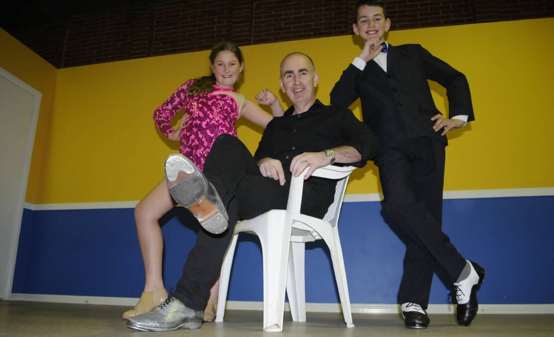 IN THE FAMILY: Paul Hughes and children Georgia, 9, and Jackson, 12, are all tap dancers. Photo: CHRIS SEABROOK 081616ctaps1