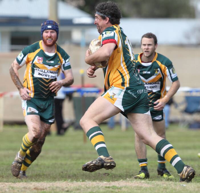 HOME: Simon Porter, supported by Ryan Porter (left) and Cameron Skinner (right), helped the Trundle Boomers First Grade side to victory on home turf on Sunday. Photo by RS Williams.