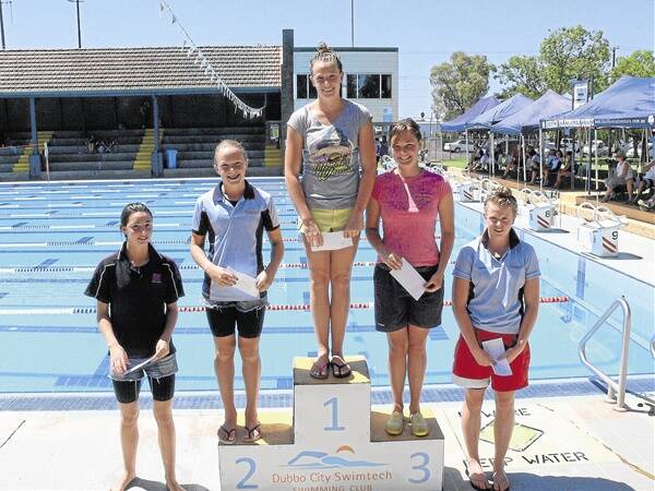 Orana swimmer Chelsea Findley (Novacastrian club) stands at the top of the dias after winning the girls 13 years and over Dash For Cash: Georgia Baker (City Swimtech) was 2nd and Keeley Buck (Nuswim) 3rd. Georgi York (Mudgee Indoor) at left was 4th and City Switmech’s Grace Sandry (at right) 5th.