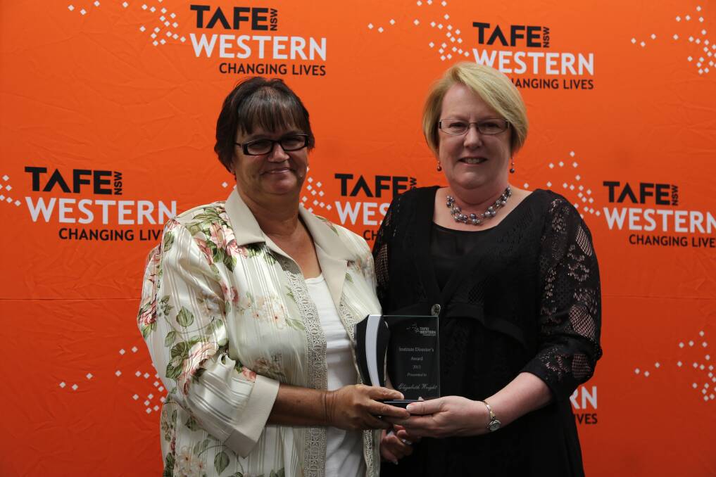 Elizabeth Aunty Beth Wright is given her award for Achievement by an Individual, by TAFE Western Institute Director Kate Baxter. 				Photos contributed