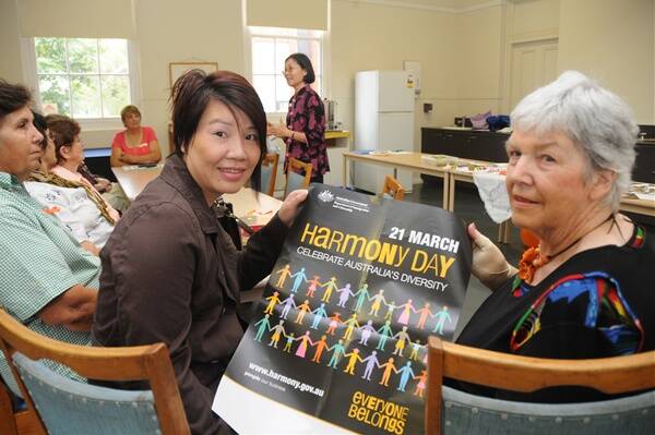Linh Tran and Gwen Young  listen while Laney Luk told her story of her move to Dubbo.       Photo: BELINDA SOOLE