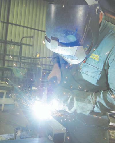Welder Mark Williams hard at work at Shanks Trailers in Dubbo. According to Ron Shanks, owner of Shanks Trailers