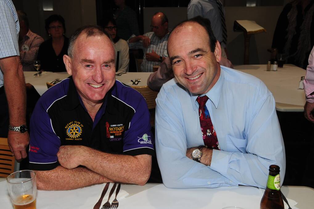 Brian Haling and Rob Exner are all smiles at the Rotary Club of Dubbo South meeting. Photo: BELINDA SOOLE