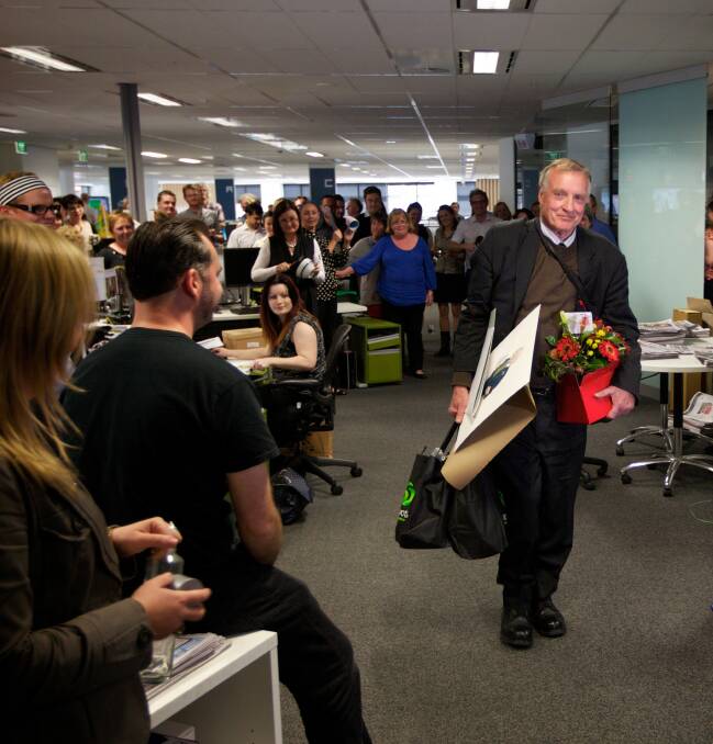 Journalist Malcolm Brown heads out of the newsroom after 40 years service at the Sydney Morning Herald.			Photo: Wolter Peeters