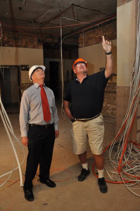 Dubbo City Council community services director David Dwyer and building consultant Mick Wilson inspect the gutted kitchen at Dubbo Regional Theatre and Convention Centre. 							   Photo: LISA MINNER