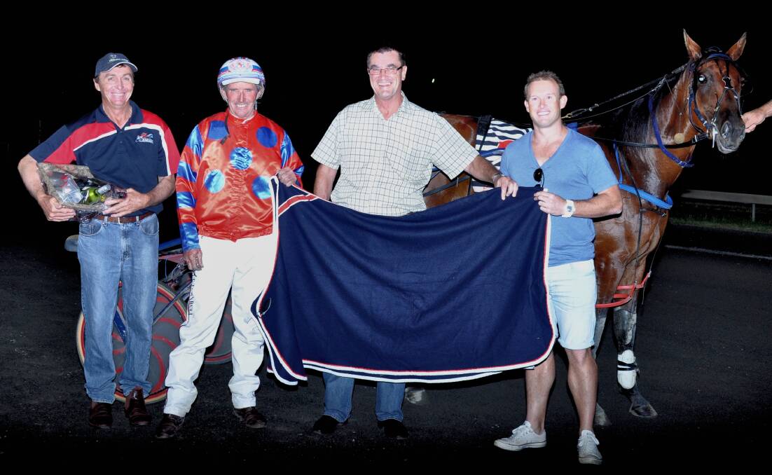Parkes Harness Racing Club president Geoff Cole with Steve Turnbull, Mick Buckley and Ben Howard after Cullectomatic's win in the Western Districts Oaks on Wednesday night. 		      Photo: COFFEE PHOTOGRAPHY