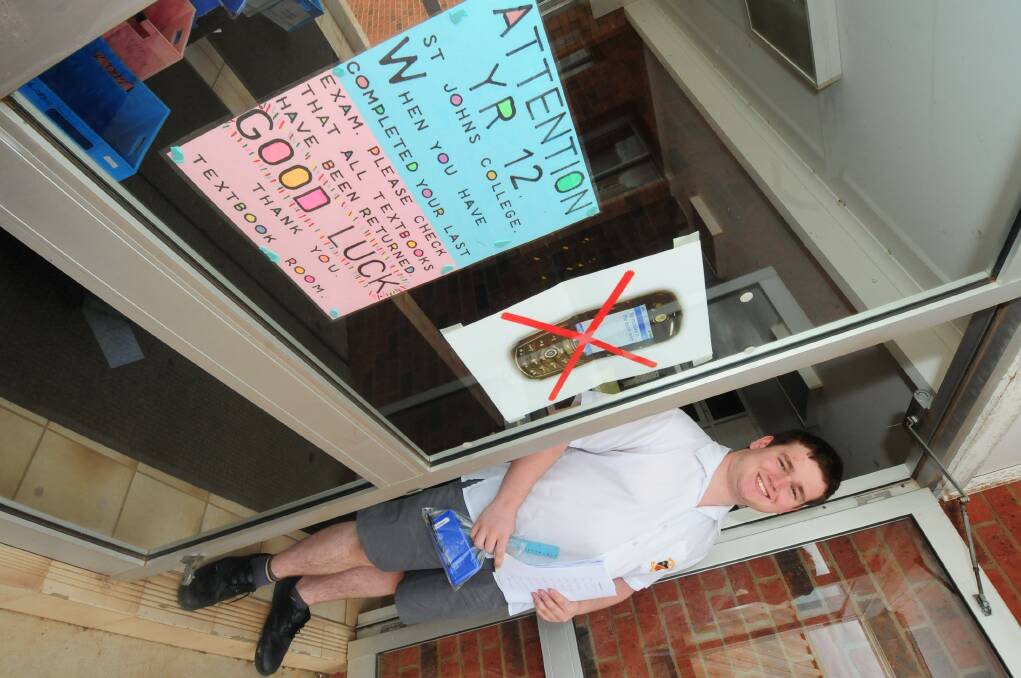 SJC year 12 student Brett Latham steps out of the exam hall after sitting his HSC mathematics exam.PHOTO: LOUISE DONGES