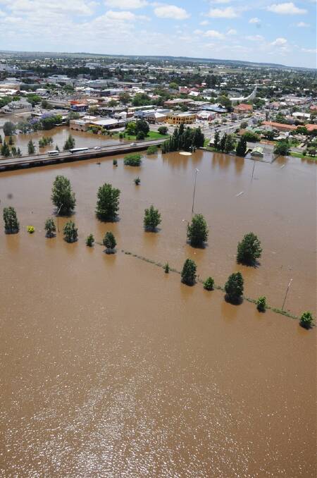 A one-in-20-year flood left half the CBD afloat. Businesses lost time, trade and valuable assets while the Macquarie River burst its banks and remained high for days.      Photo: FILE