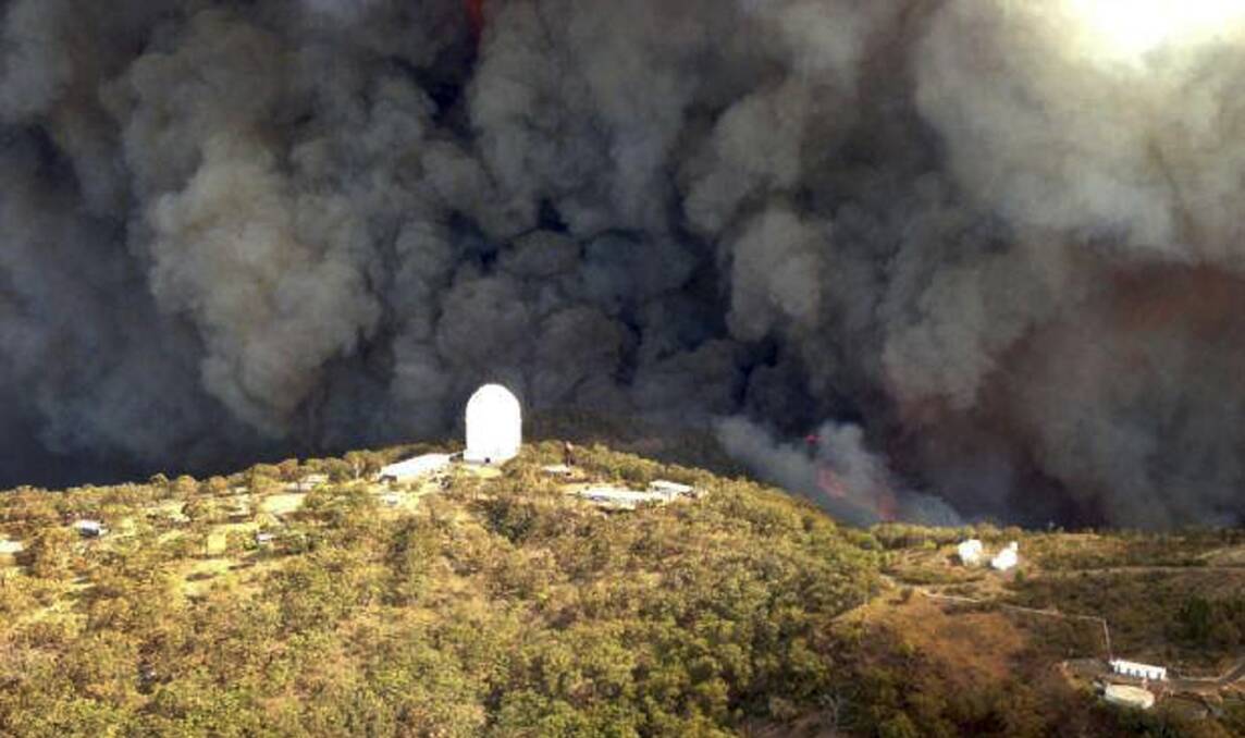 The Wambelong fire burning near the Siding Spring Observatory on January 14.  
Photo: Rural Fire Service