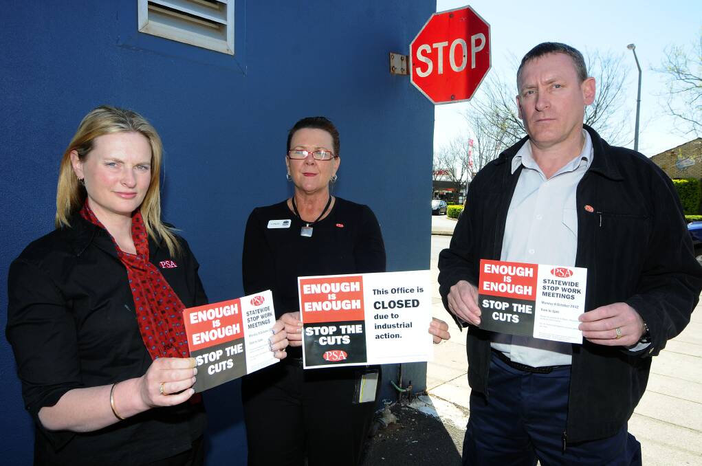 Public Service Association of NSW acting regional organiser Cassandra Coleman, member Lynda Black and delegate Peter McGlynn call on members to attend a stop-work meeting on October 8. 	 Photo: BELINDA SOOLE