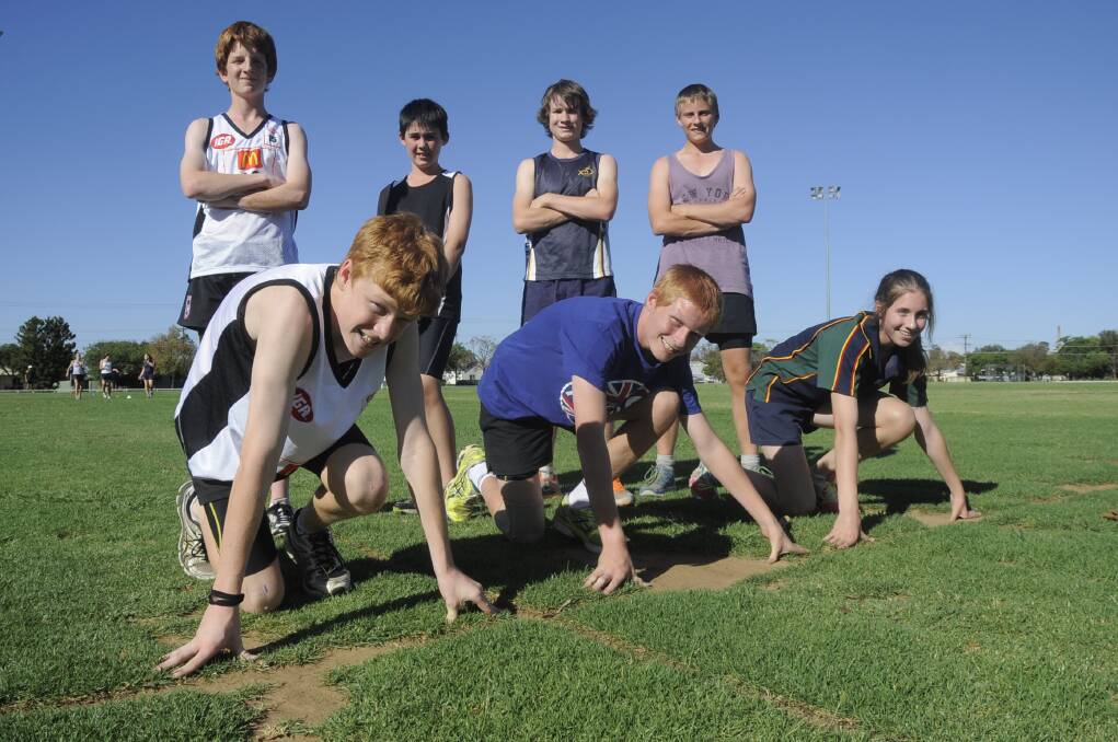 (back) Brandon Merrick, Kyle Wilson, Remus Watson and Andrew Gray with (front) Connor McDonald, Adam Gray and Isobella Cameron preparing for the New Year Athletics Carnival at Barden Park. Photo: BELINDA SOOLE