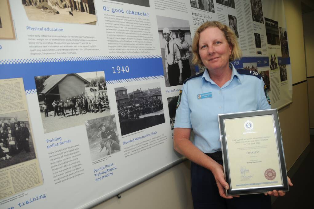 Senior Constable Wendy Manchester with her award for being a finalist of the 2012 Sabine Altmann Award for Domestic Violence Practitioner of the Year. 	Photo: AMY McINTYRE