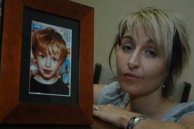Kym Coon with a photo of her nephew Julian Smith who was disembowelled by a pool filter last month.