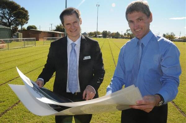 Dubbo mayor Mathew Dickerson and Dubbo City Council parks and landcare director Murray Wood reviewing the plans for Barden Park, made possible by a $3.5 million grant. 								          Photo: JOSH HEARD