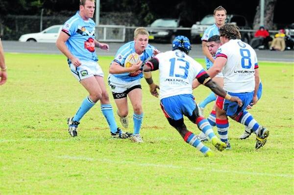 Perry Meredith takes the ball into the heart of the Parkes defence earlier in the Group 11 season. Photo: JOSH HEARD