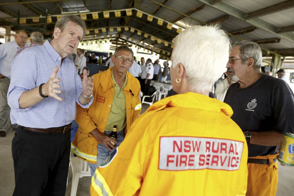 NSW premier Barry O'Farrell visited Coonabarabran on Saturday to witness the damage caused by recent bush fires and meet with RFS volunteers and community members. Photo James Brickwood.