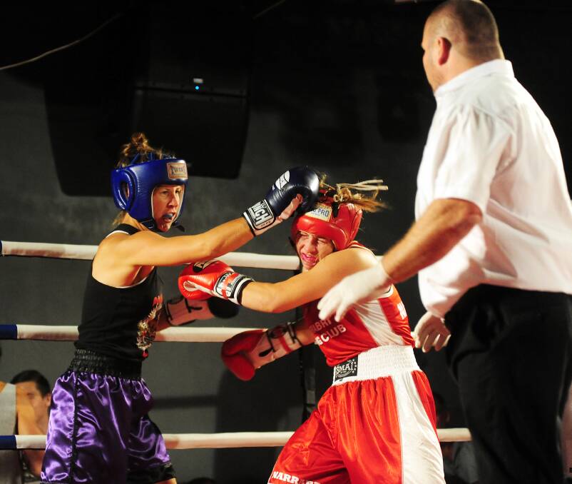 Ayla Barker lands a shot in her bout against Narrabri's Jess Webb. 	Photos: HANNAH SOOLE