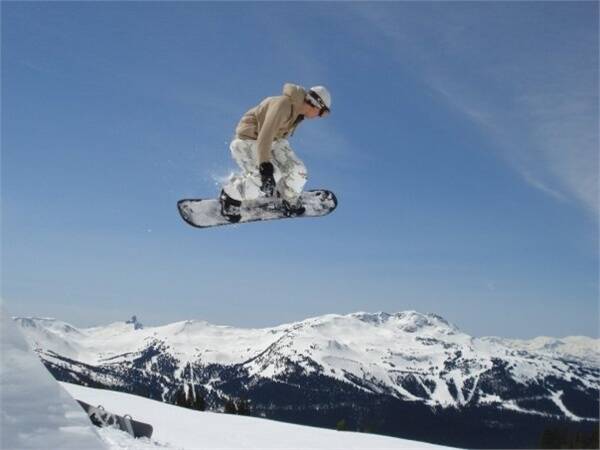 Former NSW Junior golfer Lindsay Wilson in the air doing his other passion, snowboarding.