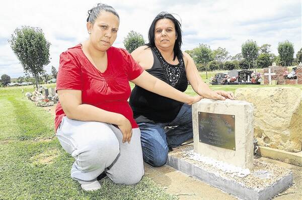 Chantelle Ryan (left) and her mother Tanya Nolan are sad and angry that the headstone of their stillborn baby cousin and niece has been vandalised at the New Dubbo Cemetery.  Photo: BELINDA SOOLE