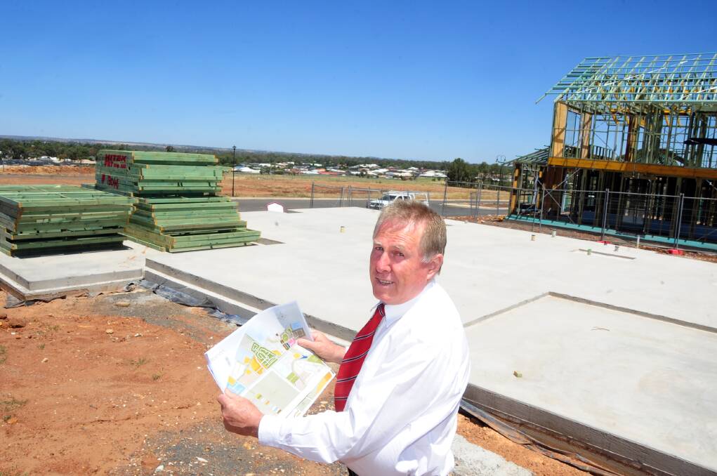 Real estate agent Peter Whalan in Delroy Park Estate, where more than 20 houses are under construction, extending Dubbo s western limits. 	Photo: BELINDA SOOLE