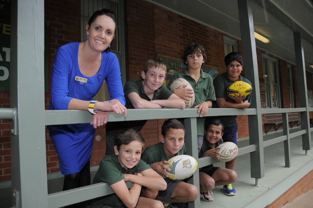 NSW Primary School Sports Association (PSSA) State Rugby League carnival organiser Amanda Thorpe with Dubbo West Public School year 5 and 6 students Jarrod Dickinson, Callum Dowling, Keenan South, Wes Toomey, Randal Dowling and Wendall Coe 
		       		      Photo: BELINDA SOOLE