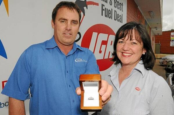 Warren Brown of Whitney’s Jewellers and IGA Coolah’s Ann Sutton, with the unclaimed diamond ring prize.