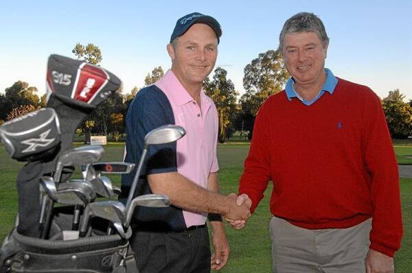 Dubbo Open golf winner Michael Wherritt (left) with Kerry Fields, sponsor of the event through his Aqua West.