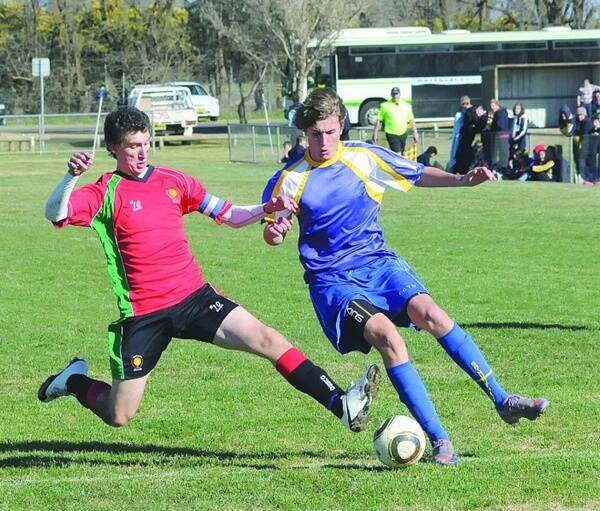 Dubbo College’s Astley Cup soccer captain Andrew Tarry challenges for the ball in yesterday’s decisive tie.
