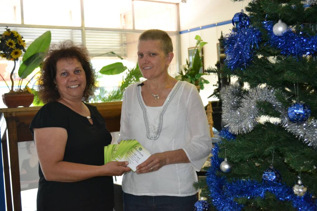 PRAYERS ANSWERED QUICKLY: The Daily Liberal advertising manager Annissa Shean handing over the 10 x $100 Midwest Foods vouchers to Trish Taylor.                                          PHOTO: ABANOB SAAD.