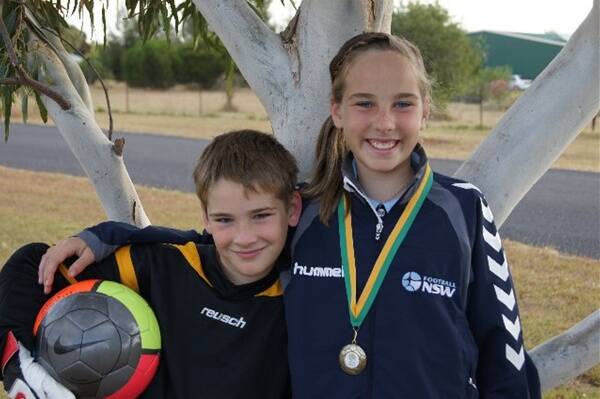 Indianna Asimus with her brother and number one supporter, Orana Spurs under-9s player Hunter Asimus.