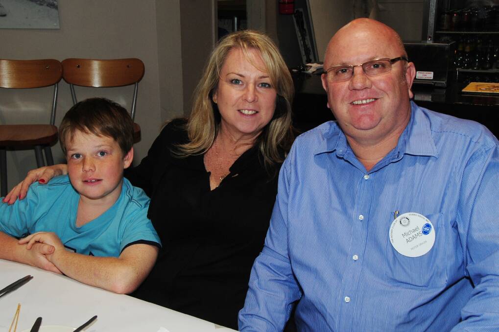 Lachie, Denelle and Michael Adams are a happy trio at the Rotary Club of Dubbo South meeting. Photo: BELINDA SOOLE