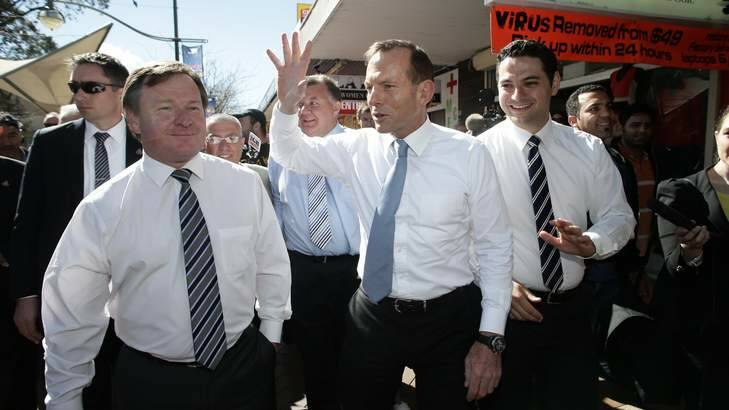 Opposition Leader Tony Abbott walks the streets of Liverpool, NSW with Kent Johns (left) , Liberal candidate for Werriwa. Photo: Alex Ellinghausen