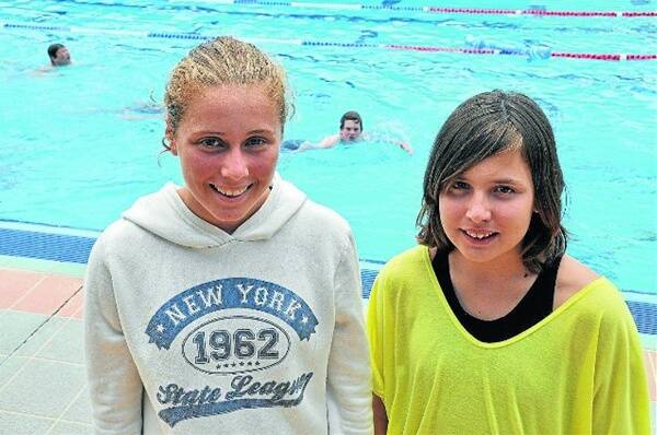 Sharnia Dimmock, 15 and Keeley Potter, 13, were two of the record breakers at the Dubbo College South Campus swimming carnival.