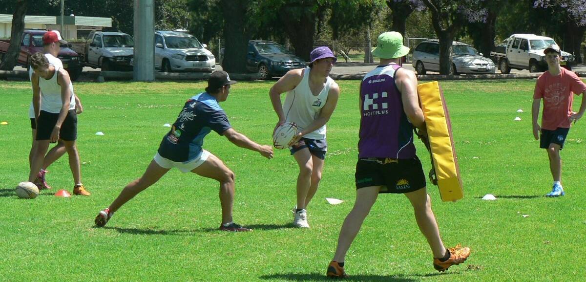 Warren's Thomas Field with the ball at the Country Rugby League Far West Academy program.          Photo: contributed