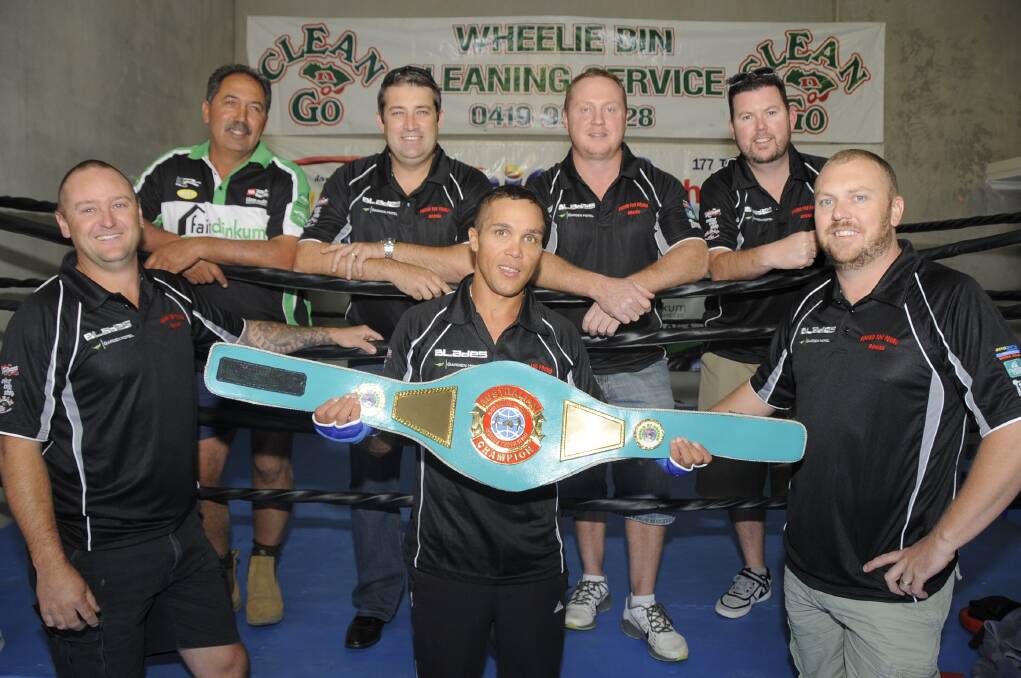 Australian lightweight champion Robert 'Gummy' Toomey shows his belt to some of the sponsors who helped him along the way - John Batistich, Mark Dee, Aaron McMillan, Mark Brown, Ben Amor and Paul Sutton. 						   Photo: BELINDA SOOLE