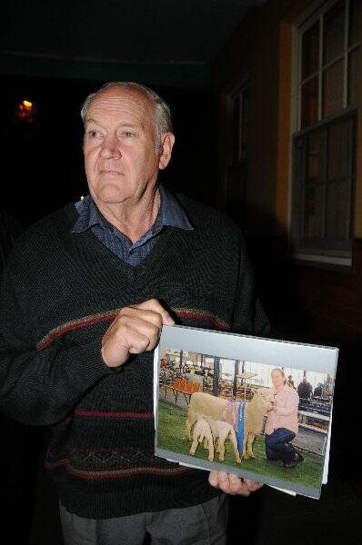 Julia's father Don McLean holds a picture of his daughter, taken the year she died, outside Dubbo Courthouse Photo: BELINDA SOOLE