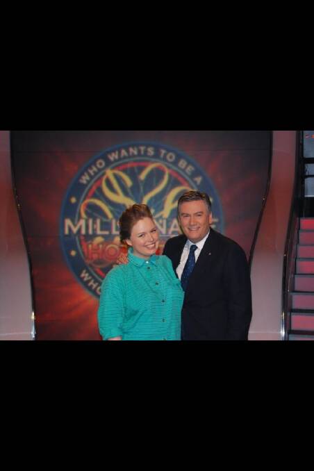 Former Dubbo resident Daisy Hicks with Millionaire Hot Seat host Eddie McGuire 
.	Photo contributed