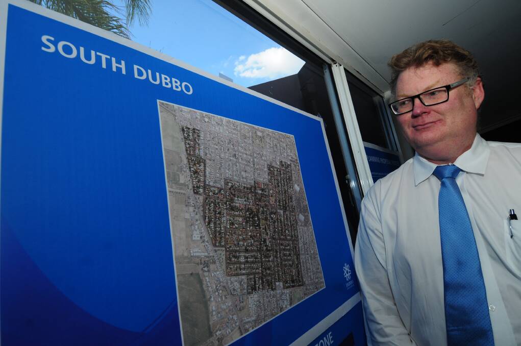 Dubbo City Council city strategy services manager Tony Aikins with a map of the subject area for the South Dubbo Housing Choice Planning Proposal. Photo: LOUISE DONGES.