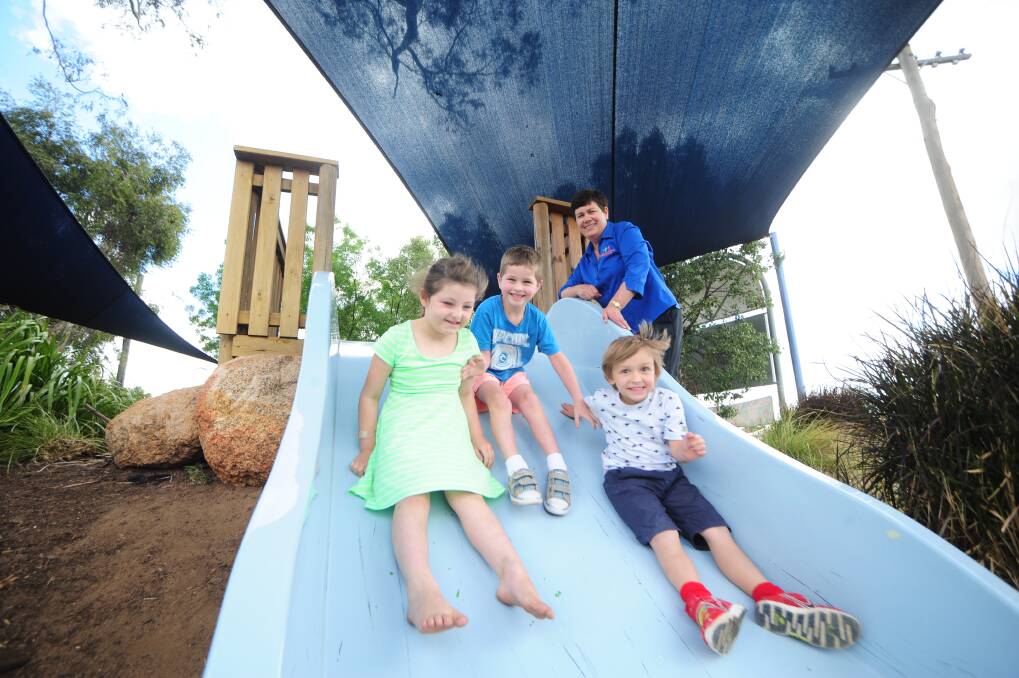 Emily Fairman, Robbie Newham and Kobey Osbourne under the supervision of Dubbo and District Preschool director Louise Simpson, who is pleased the state government has increased preschool funding for 2014. 	Photo: BELINDA SOOLE