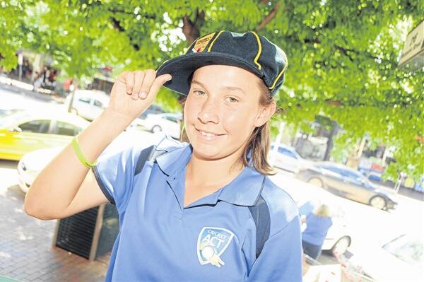 Brittany Naden with the baggy green and gold cap she got from the Australian under-15 girls cricket championships.              Photo: AMY MCINTYRE