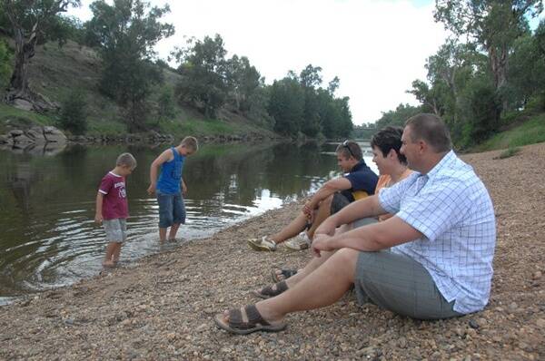 Greg, Leanne, Brandon with Joshua and Kaidyn Mohr (in water) at Sandy Beach. The Mohrs think Sandy Beach could be a possible location for Dubbo’s festival. Photo: AMY GRIFFITHS
