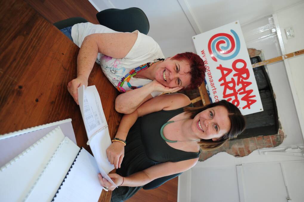 Val Clark from the Outback Writers Centre and Orana Arts projects officer Paige Williams look through a screenplay ahead of the 'Secrets, Lies and Film-making' workshop. 
Photo: LOUISE DONGES