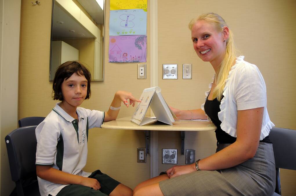 Dubbo North Public School student Georgie Mulligan is assessed by speech pathologist Ellen Stolp as part of the Royal Far West's Come N See pilot project. 													    Photo: BELINDA SOOLE