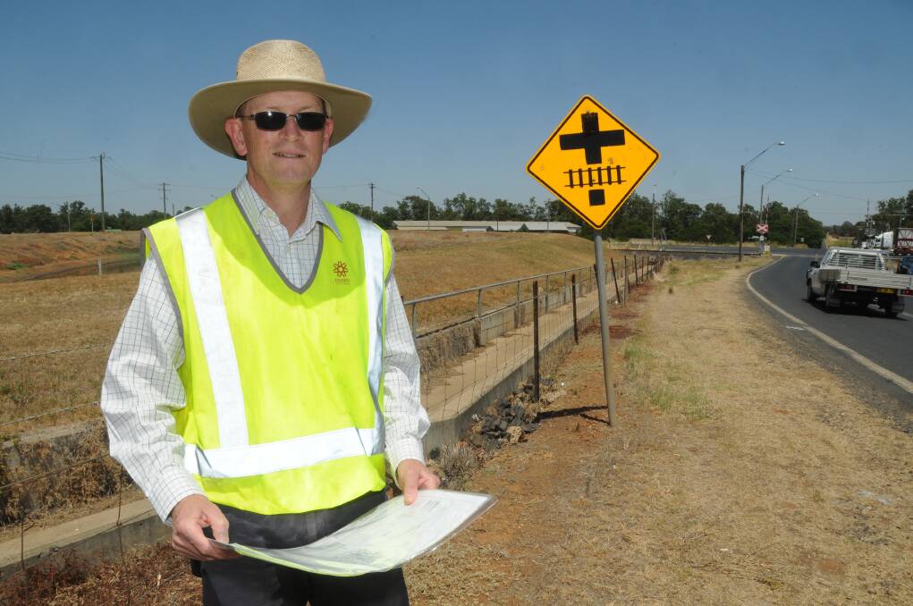 Dubbo City Council's Steve Clayton at the site earmarked for a realigned railway level crossing on Boothenba Road. 	      Photo: AMY MCINTYRE