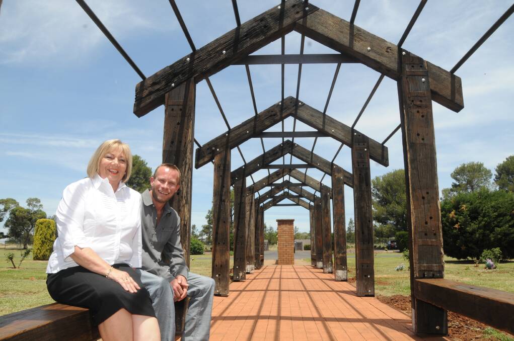 Western District Memorial Park monuments manager Lyn McDonald and Palmdale Group general manager Brad Kennedy display a newly-built arbor that will become a shaded walkway in the coming months. 	Photo: AMY McINTYRE