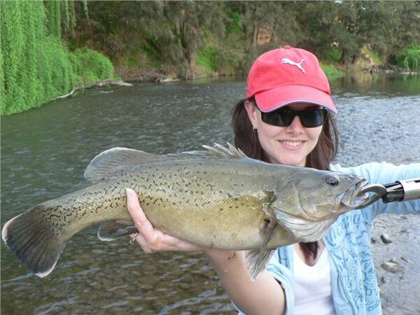 Tina Sykes with a trout cod caught in a fast flowing run on the Macquarie River.