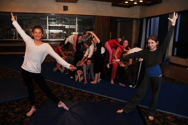 Maddi Alderdice and Allie Grant with their troupe of new friends at the Babushka holiday workshop.          Photo: Belinda Soole