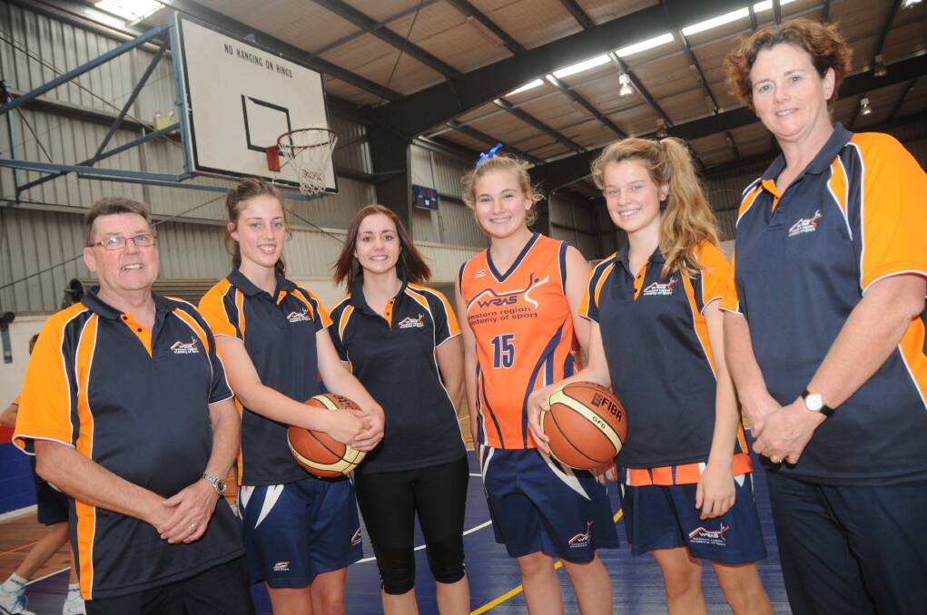 Taking a break during the WRAS basketball clinic held in Dubbo: Rod Cooper, the head coach from Young, Ashlee Bastiaansen (Orange), Nikki Collins (Bathurst), Laycee Covington (Bathurst), Lily McIntosh (Bathurst) and Karen Hood, the assistant coach.